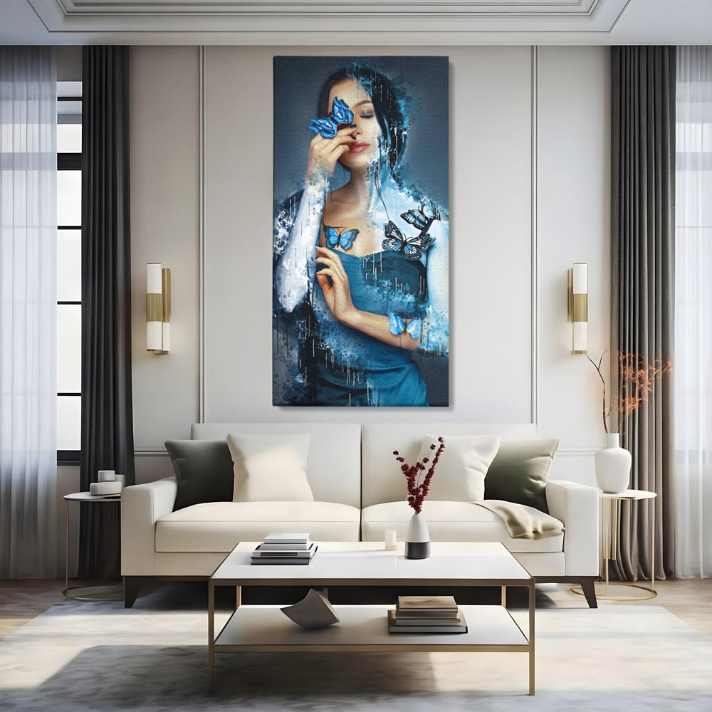 Tablou canvas cu portret feminin cu fluturi albastri, fara rama, pe sasiu de lemn, pe perete intr-un living